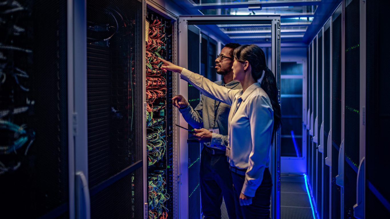 People working next to datacentre rack
