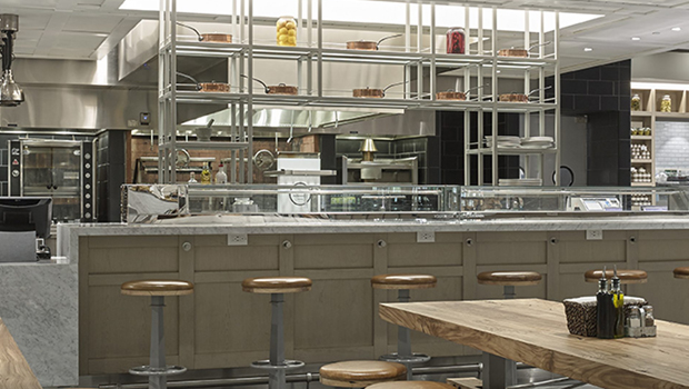 A theatre-like open kitchen and bar that invites guests to engage with the chef